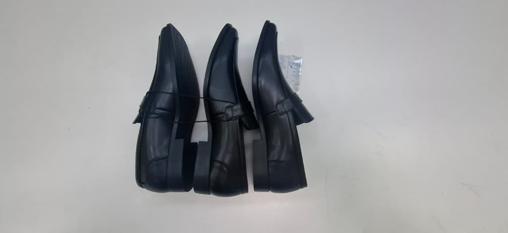 Black leather loafer samples prepared for quality review